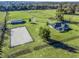 Aerial view of a home with barn, riding arena, and pastures at 7675 W Highway 326, Ocala, FL 34482