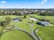 Aerial view showing the home, barn, and riding arena on the property at 7675 W Highway 326, Ocala, FL 34482