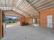 Bright barn interior with stalls, tack area, and a spacious layout at 7675 W Highway 326, Ocala, FL 34482