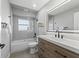 Modern bathroom with a bathtub, shower, and updated vanity at 7675 W Highway 326, Ocala, FL 34482