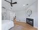 Main bedroom with fireplace and access to another room at 7675 W Highway 326, Ocala, FL 34482