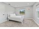 Bedroom with double bed and carpet flooring, view of the backyard at 7675 W Highway 326, Ocala, FL 34482