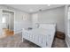 Bedroom with double bed and carpet flooring, access to the bathroom at 7675 W Highway 326, Ocala, FL 34482