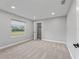 Spacious bedroom with carpet flooring and a large window at 7675 W Highway 326, Ocala, FL 34482