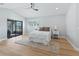 Main bedroom with sliding doors to patio and hardwood floors at 7675 W Highway 326, Ocala, FL 34482