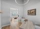 Home office with view into living room, light hardwood floors, and modern decor at 7675 W Highway 326, Ocala, FL 34482