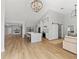 Modern kitchen with white cabinets, island, and open floor plan at 7675 W Highway 326, Ocala, FL 34482