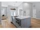 Large kitchen island with white quartz countertop and farmhouse sink at 7675 W Highway 326, Ocala, FL 34482