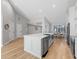 Modern kitchen with white cabinets, quartz countertops, and stainless steel appliances at 7675 W Highway 326, Ocala, FL 34482