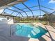 Inviting screened pool with ample space for lounging and enjoying the view at 7675 W Highway 326, Ocala, FL 34482