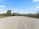 Spacious riding arena with a sand surface, enclosed by a black post and rail fence at 7675 W Highway 326, Ocala, FL 34482