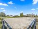 Large riding arena perfect for equestrian activities with scenic views at 7675 W Highway 326, Ocala, FL 34482