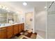 Double vanity bathroom with a walk-in shower and tiled floors at 8086 Sw 81St Loop, Ocala, FL 34476