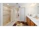 Large bathroom with a walk-in shower, double vanity, and linen closet at 8086 Sw 81St Loop, Ocala, FL 34476