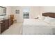 Relaxing bedroom with wicker bed frame, dresser and plenty of closet space at 8086 Sw 81St Loop, Ocala, FL 34476
