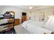Bright bedroom with a comfortable bed, treadmill, and ample closet space at 8086 Sw 81St Loop, Ocala, FL 34476