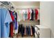 Well-organized walk-in closet with hanging rods and shelving at 8086 Sw 81St Loop, Ocala, FL 34476
