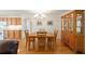 Bright dining room with wood table and chairs, hardwood floors and built-in hutch at 8086 Sw 81St Loop, Ocala, FL 34476