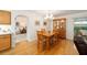 Bright dining room with wood table and chairs, hardwood floors and built-in hutch at 8086 Sw 81St Loop, Ocala, FL 34476