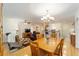 Open dining room with hardwood floors and view into living room at 8086 Sw 81St Loop, Ocala, FL 34476
