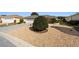 Landscaped yard with gravel and a large shrub at 8086 Sw 81St Loop, Ocala, FL 34476