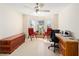 Home office with built-in desk, two comfy chairs, and large window at 8086 Sw 81St Loop, Ocala, FL 34476