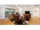 Relaxing living room with hardwood floors, comfortable recliners, and a ceiling fan at 8086 Sw 81St Loop, Ocala, FL 34476