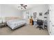 Bedroom with a king-size bed, workspace, and window at 8405 Sw 82Nd Loop, Ocala, FL 34481