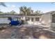 Back patio with golf cart and access to a grassy backyard at 8580 Sw 97Th Lane Rd # B, Ocala, FL 34481