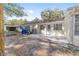 Back patio with golf cart and access to a grassy backyard at 8580 Sw 97Th Lane Rd # B, Ocala, FL 34481