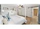 Main bedroom with white post bed and ensuite bathroom at 8580 Sw 97Th Lane Rd # B, Ocala, FL 34481