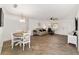 Open concept dining room with table and chairs, view into living room at 8580 Sw 97Th Lane Rd # B, Ocala, FL 34481