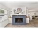 Gray brick fireplace with a white shiplap accent wall at 8580 Sw 97Th Lane Rd # B, Ocala, FL 34481