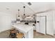 Modern kitchen with white cabinets, center island, and breakfast bar at 8580 Sw 97Th Lane Rd # B, Ocala, FL 34481