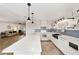 Open concept kitchen with white cabinets, island, and view of living room at 8580 Sw 97Th Lane Rd # B, Ocala, FL 34481
