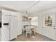 Bright kitchen with white cabinets, breakfast nook, and tile floors at 8580 Sw 97Th Lane Rd # B, Ocala, FL 34481