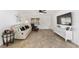 Bright living room featuring a comfortable sofa, large TV, and tile flooring at 8580 Sw 97Th Lane Rd # B, Ocala, FL 34481