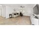 Open concept living room featuring a comfortable couch and large TV at 8580 Sw 97Th Lane Rd # B, Ocala, FL 34481