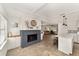Open concept living area with a gray brick fireplace and kitchen island at 8580 Sw 97Th Lane Rd # B, Ocala, FL 34481
