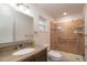 Updated bathroom with walk-in shower, granite vanity and modern fixtures at 8653 Sw 96Th St # A, Ocala, FL 34481