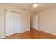 Bedroom with hardwood floors, double closets and ceiling fan at 8653 Sw 96Th St # A, Ocala, FL 34481