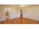 Bedroom with hardwood floors, an ensuite bathroom, and ample closet space at 8653 Sw 96Th St # A, Ocala, FL 34481