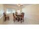 Dining area with wood table and chairs, tile floors at 8653 Sw 96Th St # A, Ocala, FL 34481