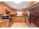 Well-equipped kitchen, granite counters, wood cabinets, and stainless steel appliances at 8653 Sw 96Th St # A, Ocala, FL 34481