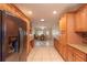 Open kitchen with stainless steel appliances and view into dining area at 8653 Sw 96Th St # A, Ocala, FL 34481