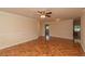 Open living space with hardwood floors and access to other rooms at 8653 Sw 96Th St # A, Ocala, FL 34481
