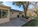 Brick paved patio with built-in planter next to large tree at 8653 Sw 96Th St # A, Ocala, FL 34481