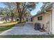 Backyard patio with landscaping and AC unit at 8653 Sw 96Th St # A, Ocala, FL 34481