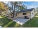Brick patio with landscaping and AC unit at 8653 Sw 96Th St # A, Ocala, FL 34481