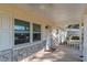 Front porch with windows and a ceiling fan at 8653 Sw 96Th St # A, Ocala, FL 34481